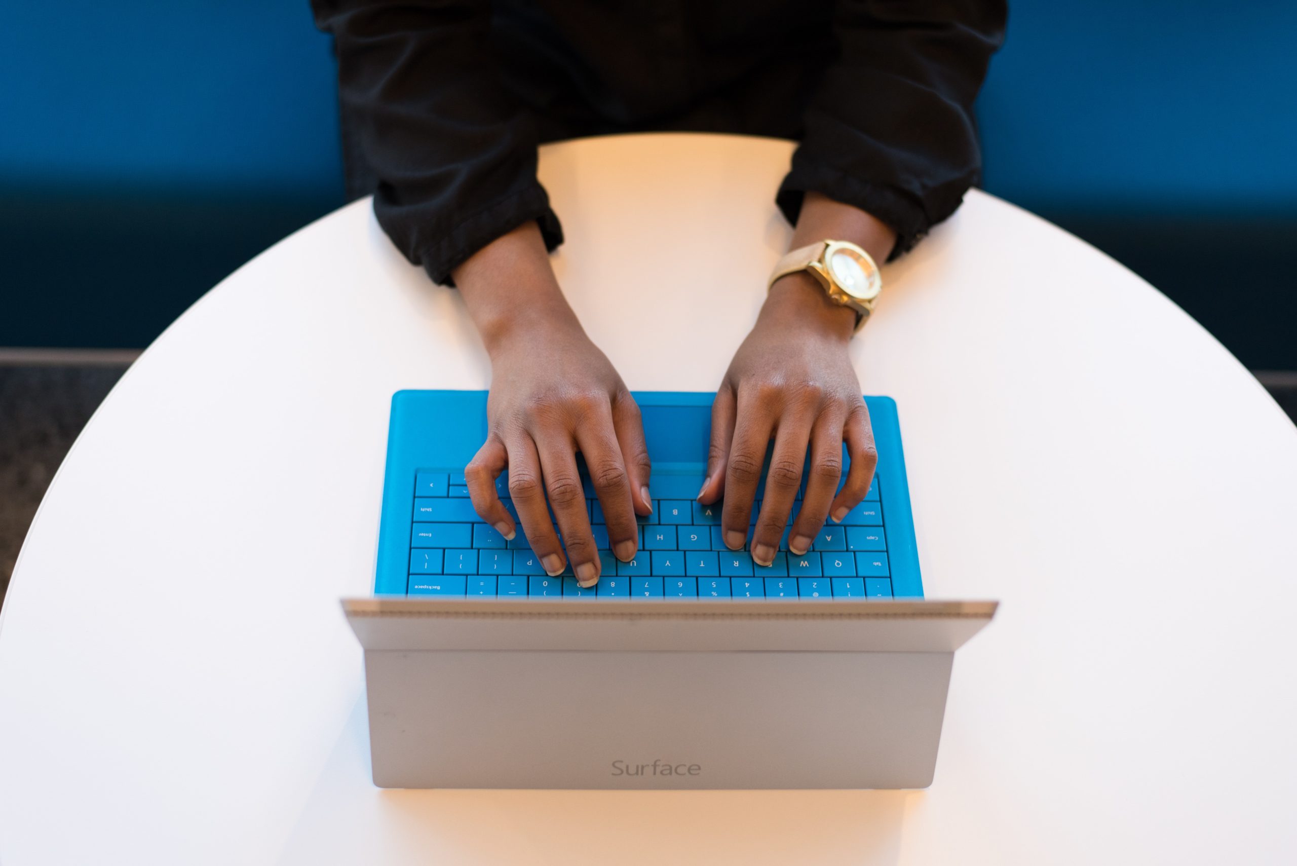 Woman typing Pastor Job Description on her computer