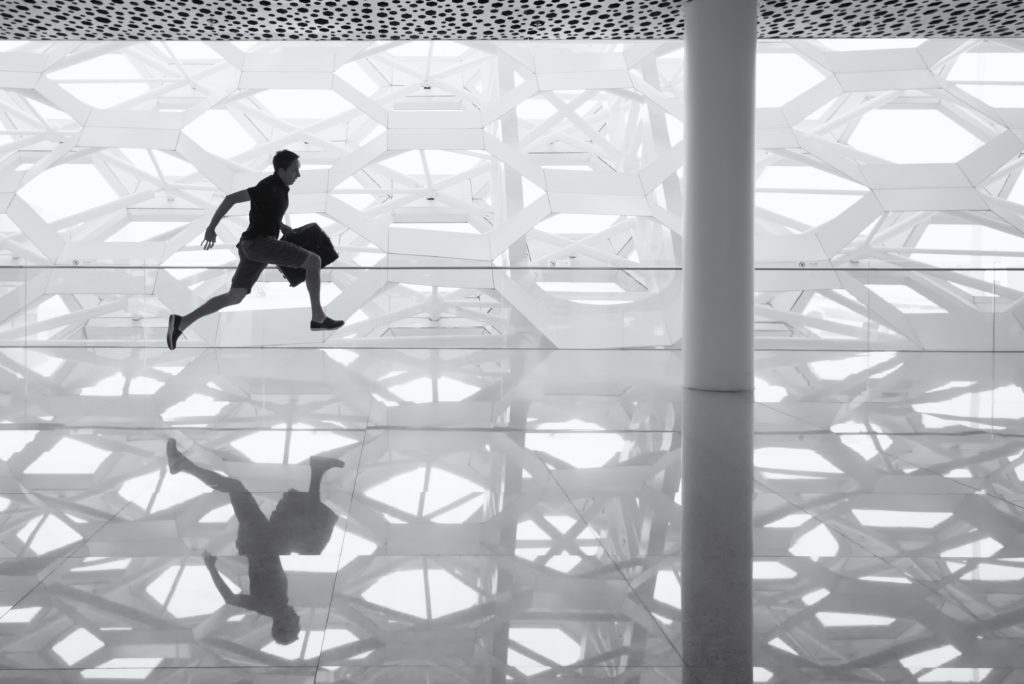 man running with a bag