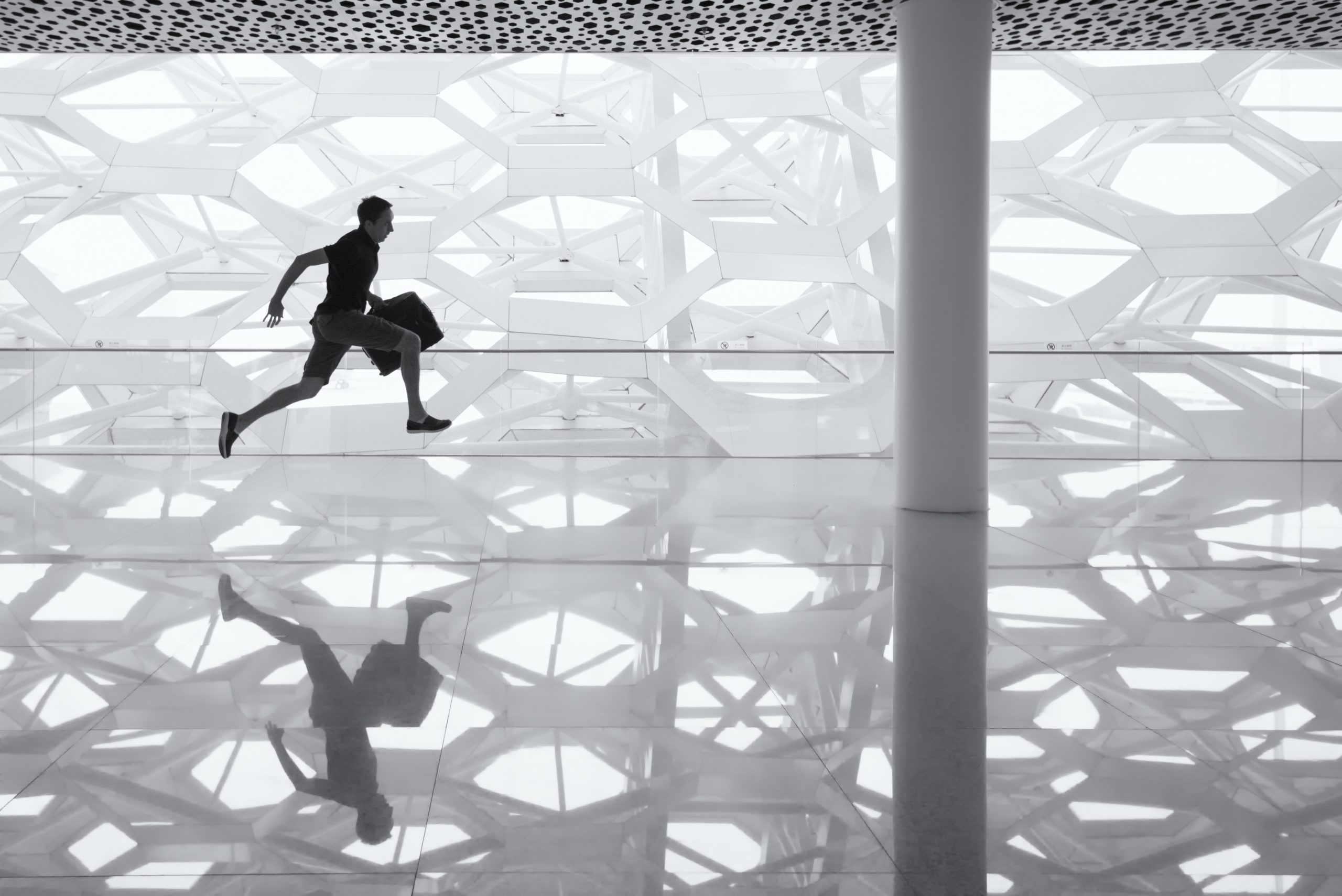 man running with a bag