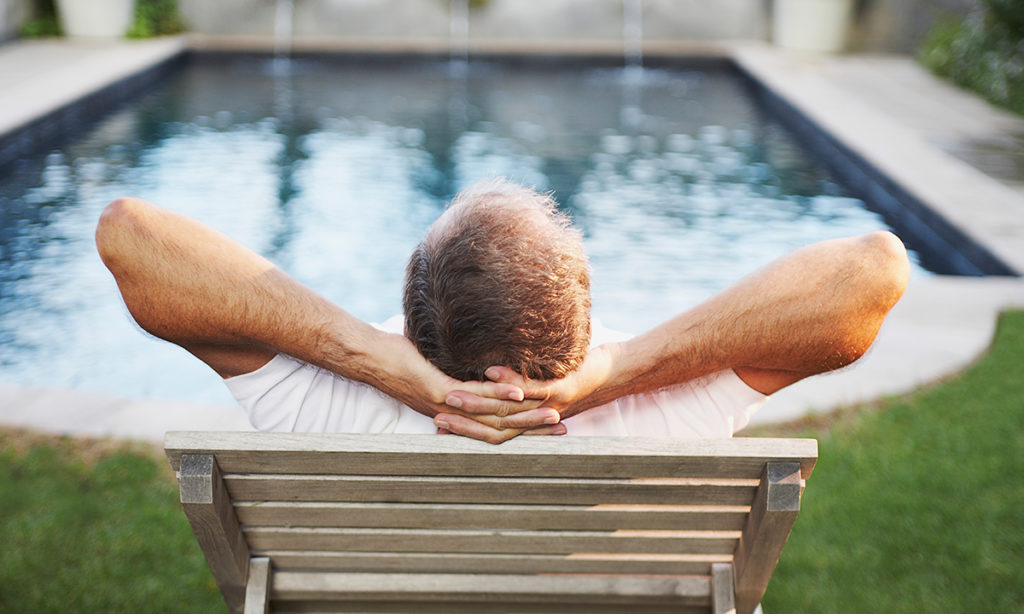 Pastor relaxing because his church has fair PTO policies for pastors.